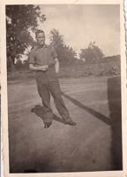 Stylish man standing in a sunlit clearing
