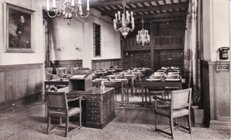 Historic classroom setting with wooden furniture