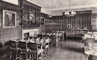 Elegant dining hall with rich woodwork and decor