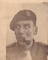 Serious soldier with a pipe enjoying a moment