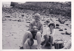 Children enjoying a sunny beach day with snacks