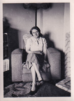 Woman sitting elegantly in a cozy living room
