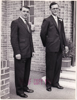 Stylish gentlemen pose together in classic suits