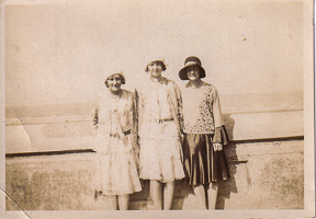 Joyful friends enjoying a sunny day by the sea