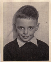 Young boy with a charming smile in black and white