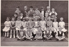 Children gather for a group photograph at school