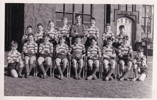 Young rugby team poses proudly at school in 1963