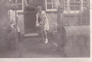 Girl playing with a dog at a local kennel