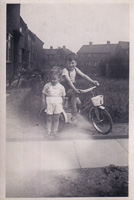 Two children enjoying a sunny day on bikes