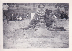 Family fun at the beach with sandcastle building