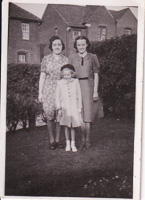 Three generations smiling in the sun