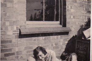 Enjoying a moment of quiet outside a brick wall