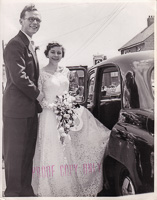 Couple celebrates wedding with vintage car