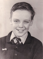 Smiling boy in vintage school clothes