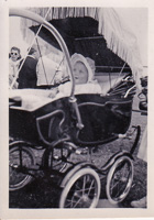 Baby enjoying a sunny day in a vintage stroller