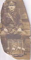 Soldier seated with drum during historic moment