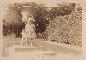 Little girl enjoying the sunny garden day
