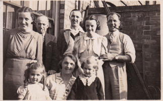 Family gathering in a sunny courtyard