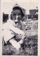 Toddler exploring a flower garden