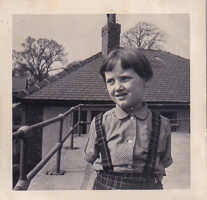 Young child enjoying a sunny day on the roof