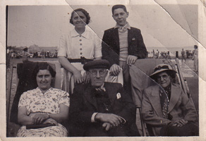 Family gathering at the beach in vintage style