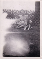 Mother and sons enjoying a sunny day in the yard
