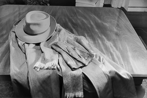 Elegant attire laid out on a polished wooden table