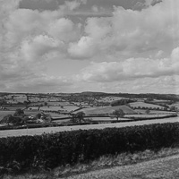 Rolling hills and vibrant skies over countryside