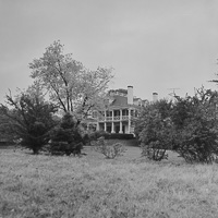 Historic mansion surrounded by autumn foliage