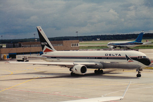 Vintage aircraft awaits takeoff at busy airport