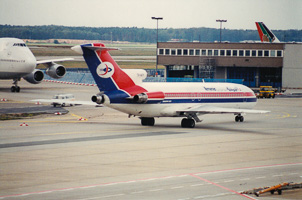 Vintage plane at busy airport terminal