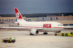 Airplane prepares for boarding at bustling airport
