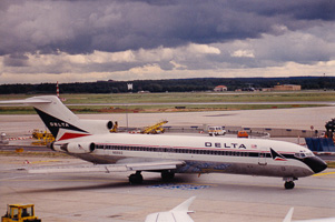 Classic aircraft gliding through a cloudy airport