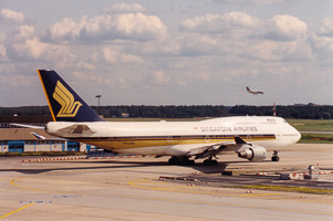 Vintage planes at a busy sunny airport