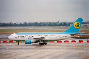 Uzbekistan Airways jet taxiing on a cloudy day