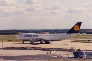 Cargo plane taxiing under a sunny sky