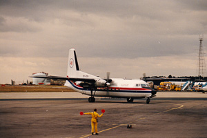 Airplane taxiing on a cloudy day at the airport