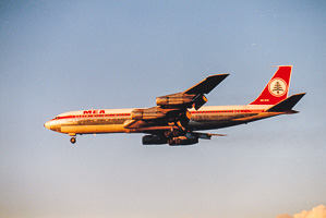 Classic jetliner soaring through a golden sunset