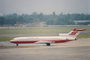 Vintage aircraft taking off in a cloudy sky