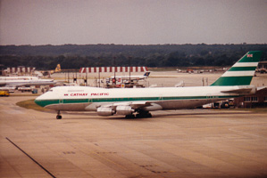 Vintage aircraft on the runway at a busy airport