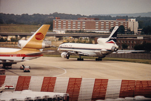 Vintage aircraft on a bustling airport tarmac