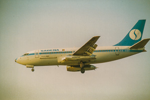 Classic airliner approaches landing at sunset