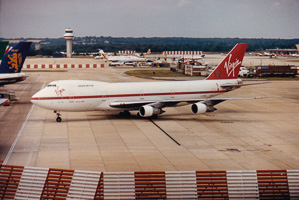 Classic airliner taxiing on a bustling runway