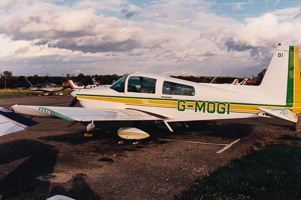 Vintage aircraft parked on a cloudy day