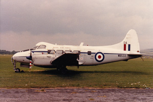 Historic planes at an overcast airfield
