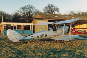 Biplane at airfield at sunset