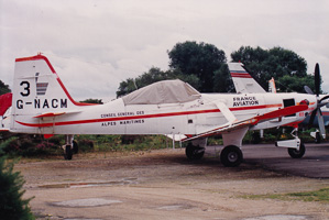 Historic aircraft sits in a quiet aviation yard