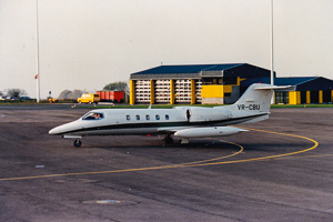 Private jet cruising on the runway at sunset