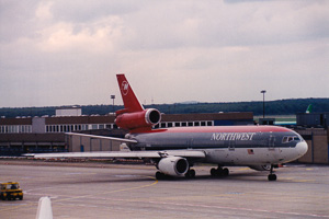 Historic airplane at the bustling airport terminal