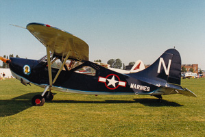 Vintage military planes on grassy field
